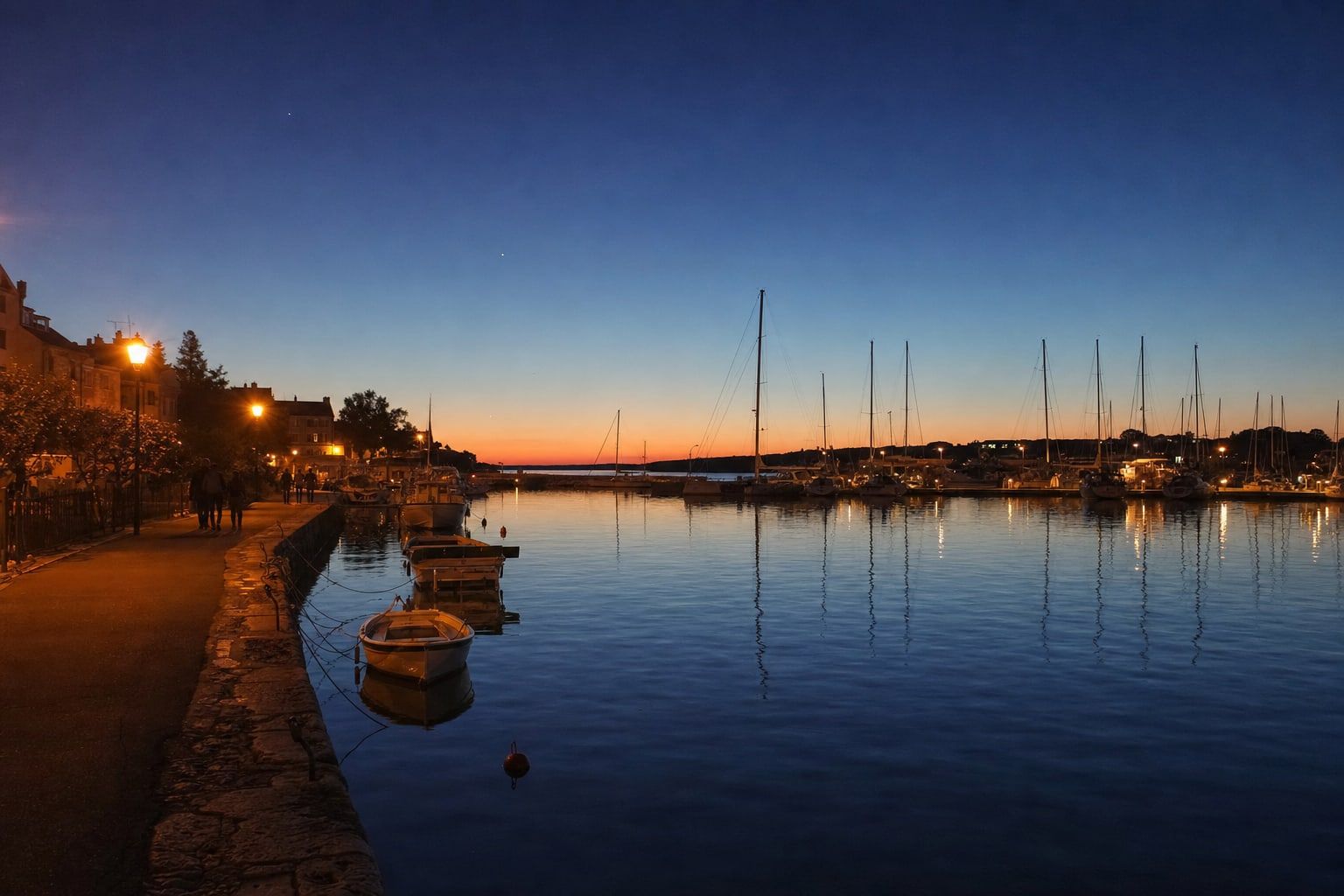 A harbour in deep blue twilight after sunset