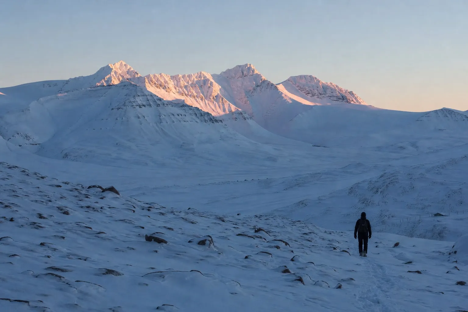 The sun returns First sunlight touching snowy Arctic peaks after the polar night