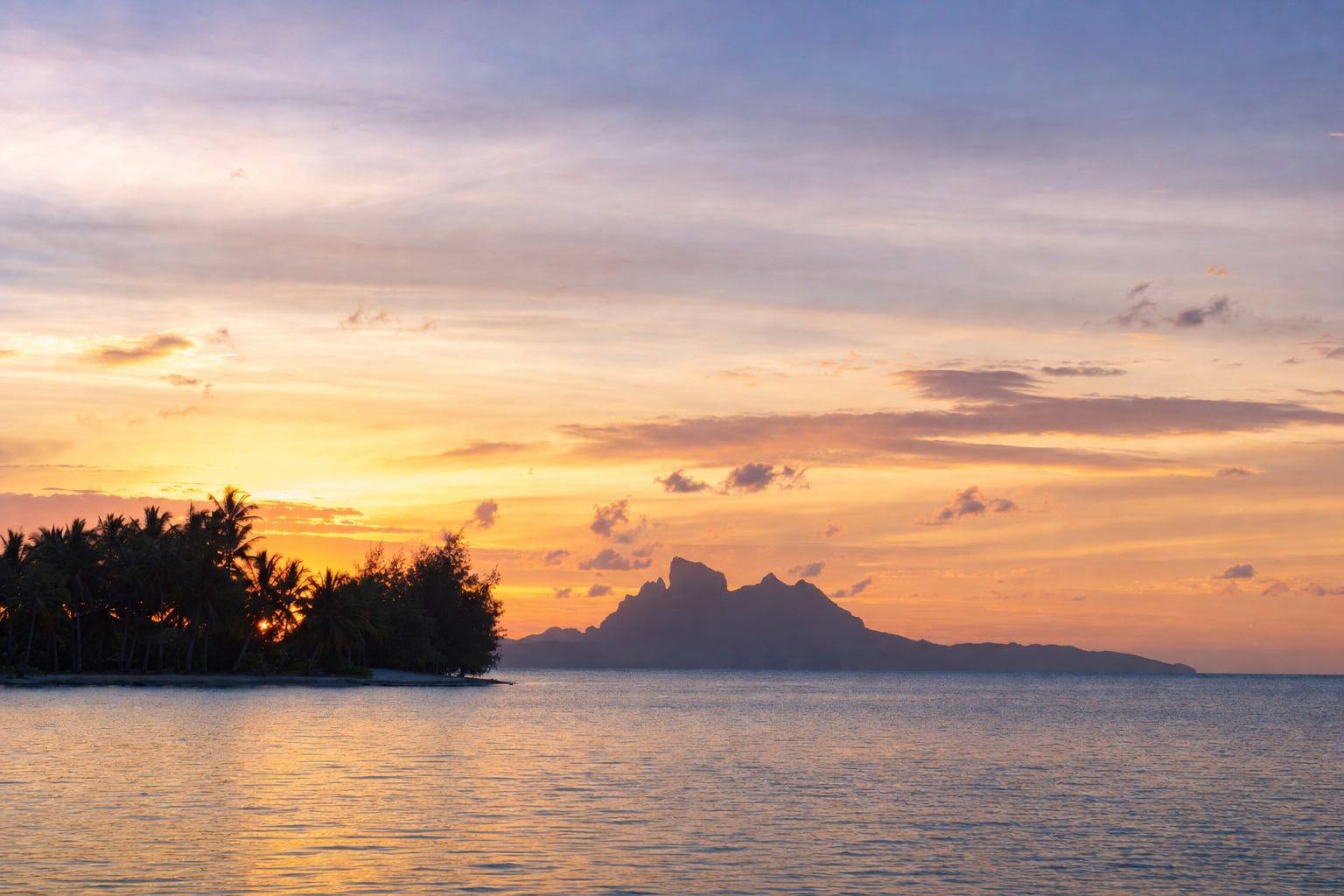 Sunset over Bora Bora Sunset over the lagoon of Bora Bora with Mount Otemanu in the distance