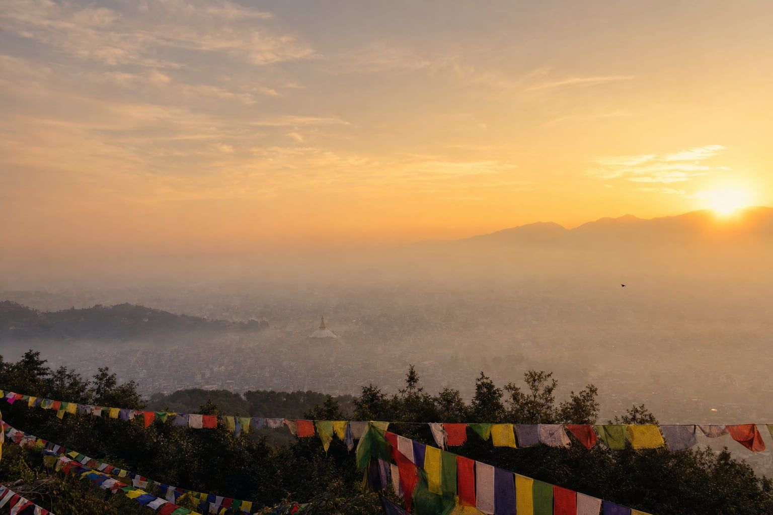 Sunrise over Boudhanath, Kathmandu Sunrise over the Kathmandu valley with prayer flags and the Boudhanath stupa far away