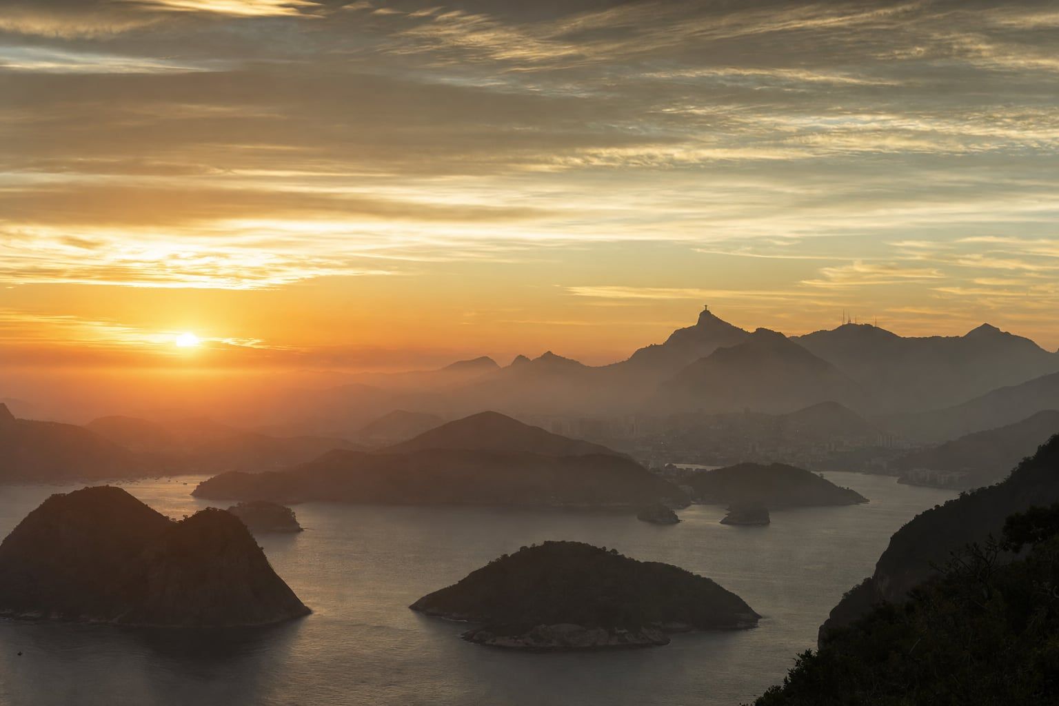 Sunrise over Rio de Janeiro Sunrise over Rio de Janeiro with Christ the Redeemer far away on Corcovado