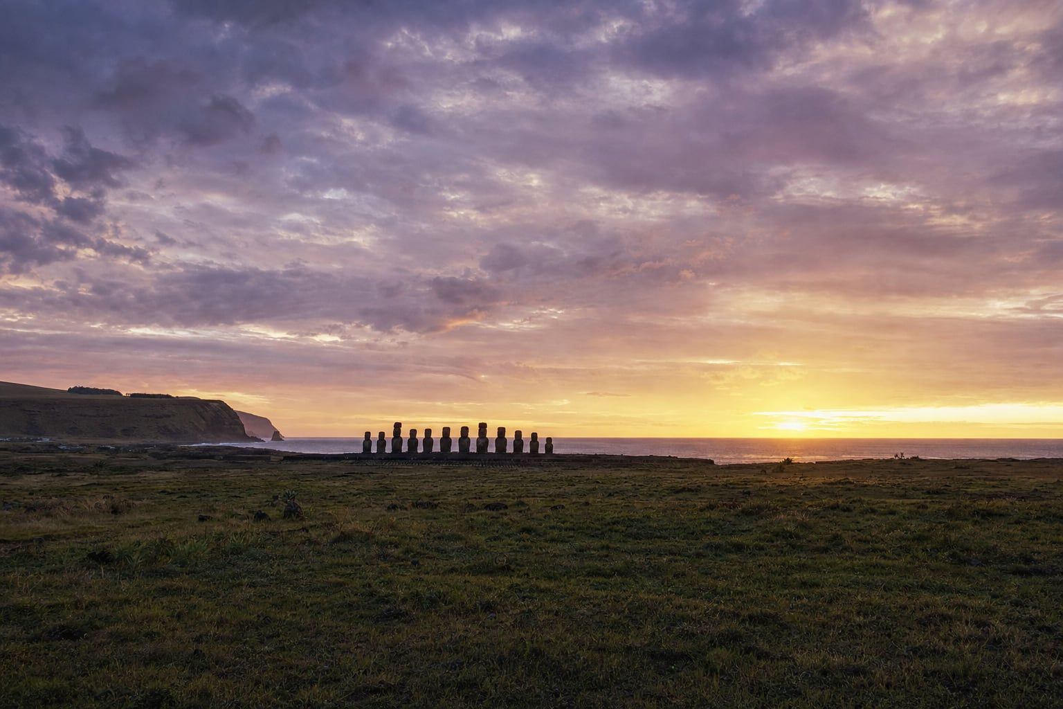 Sunrise at Ahu Tongariki, Easter Island Sunrise behind the row of moai at Ahu Tongariki, Easter Island