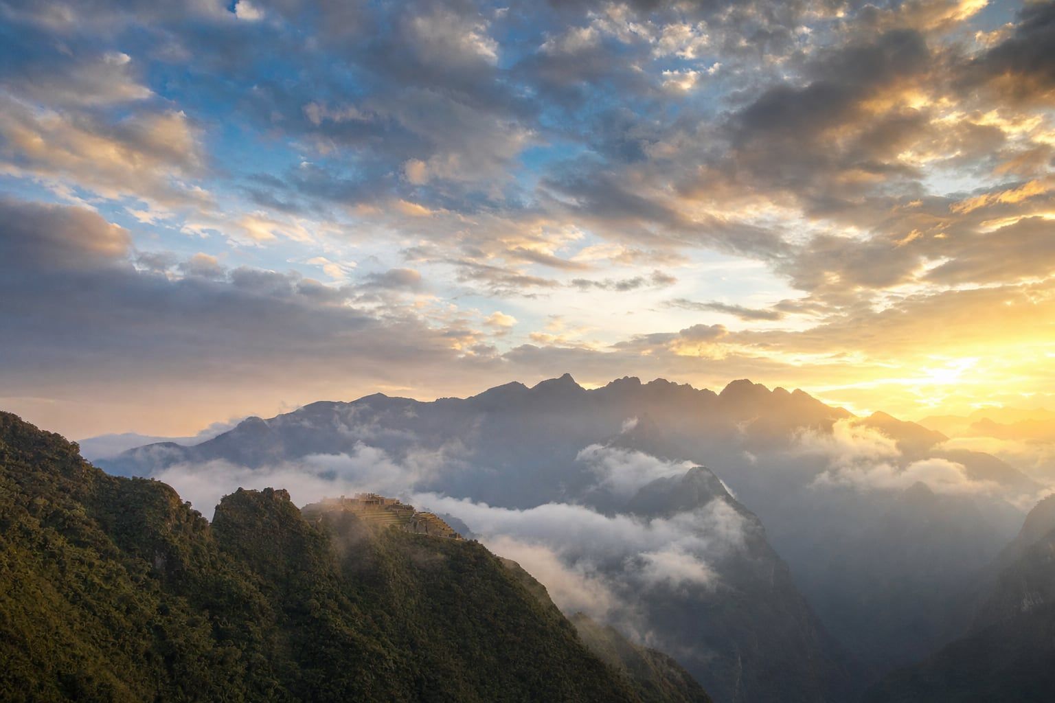 Sunrise over Machu Picchu Sunrise breaking through the clouds over Machu Picchu