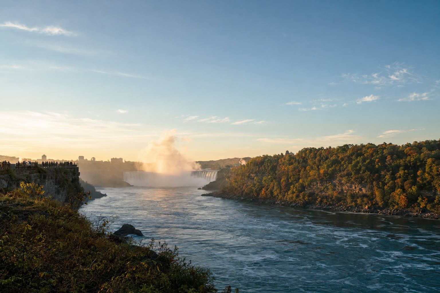 Sunrise at Niagara Falls Sunrise mist and a rainbow over Niagara Falls