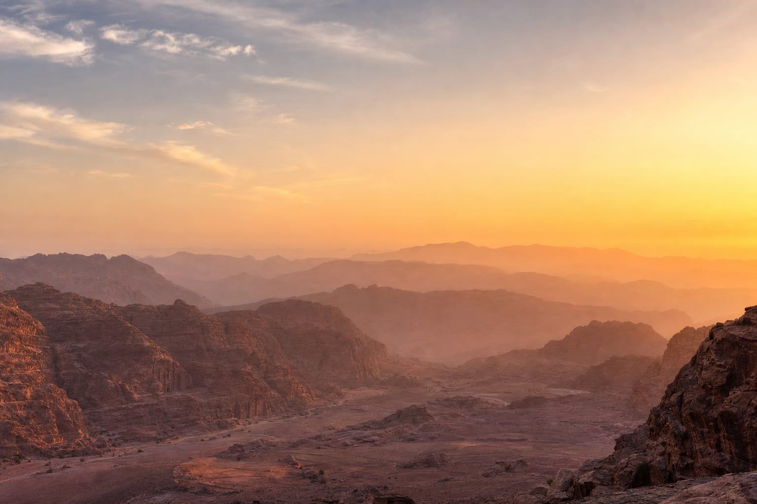 Sunrise over Petra Sunrise over the rose-coloured sandstone mountains of Petra
