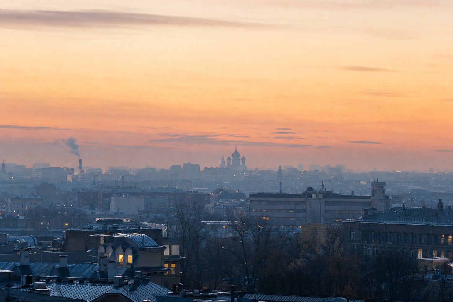 Sunrise over Moscow and Red Square Sunrise over Moscow with cathedral domes as distant silhouettes in the mist