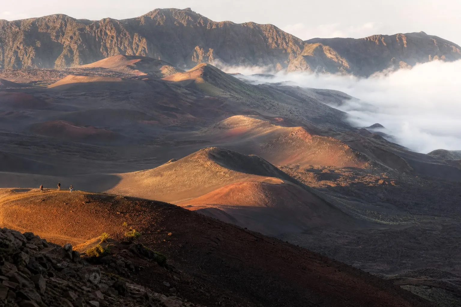 Volcanic crater with cinder cones in early morning light